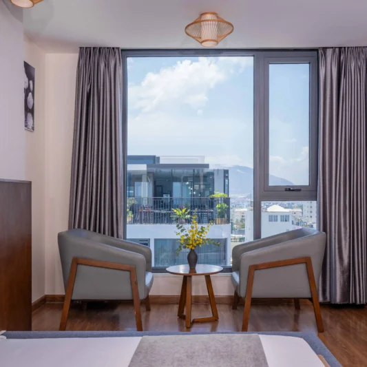 Deluxe City View room at DTX Hotel Nha Trang with modern design and city skyline