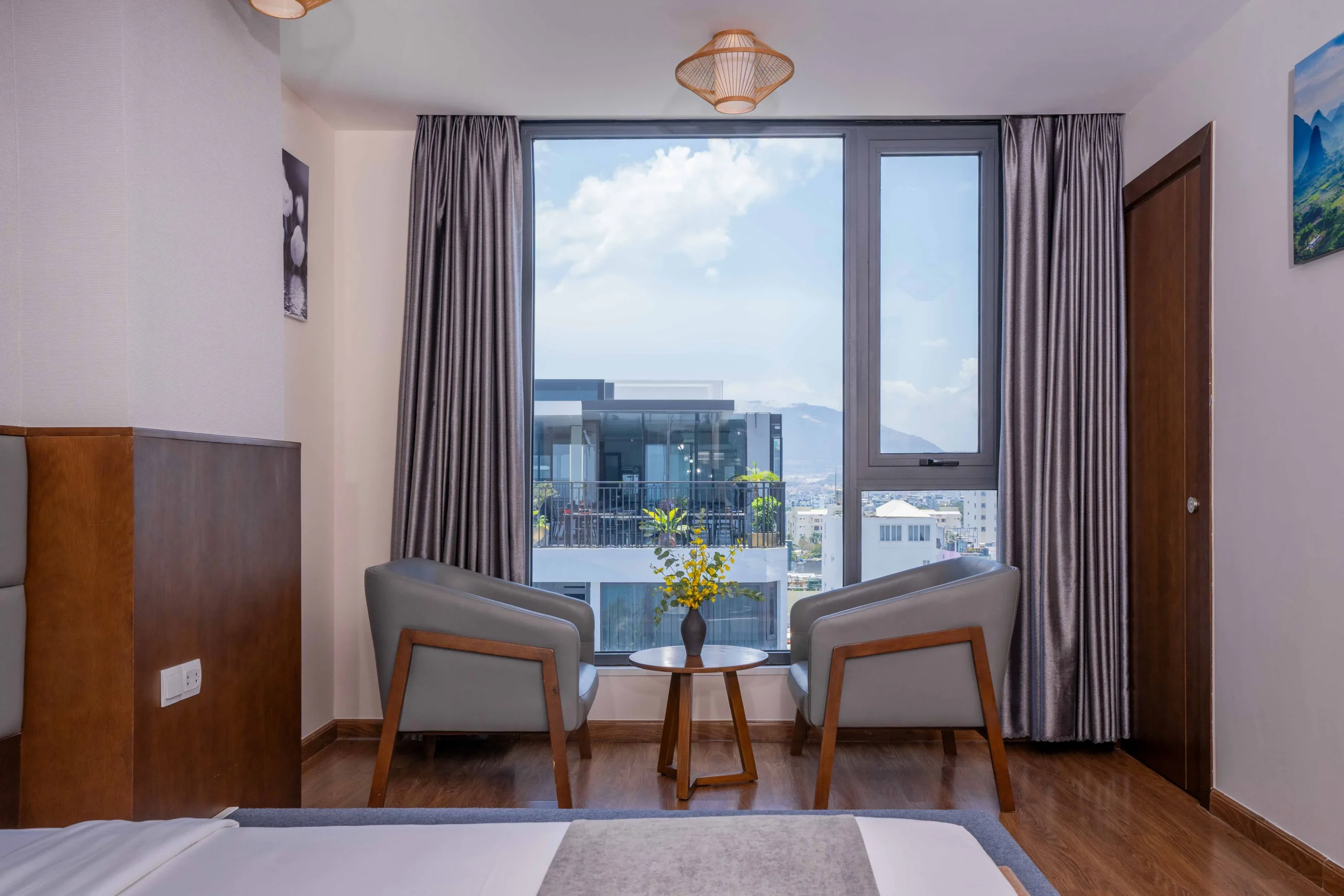 Deluxe City View room at DTX Hotel Nha Trang with modern design and city skyline
