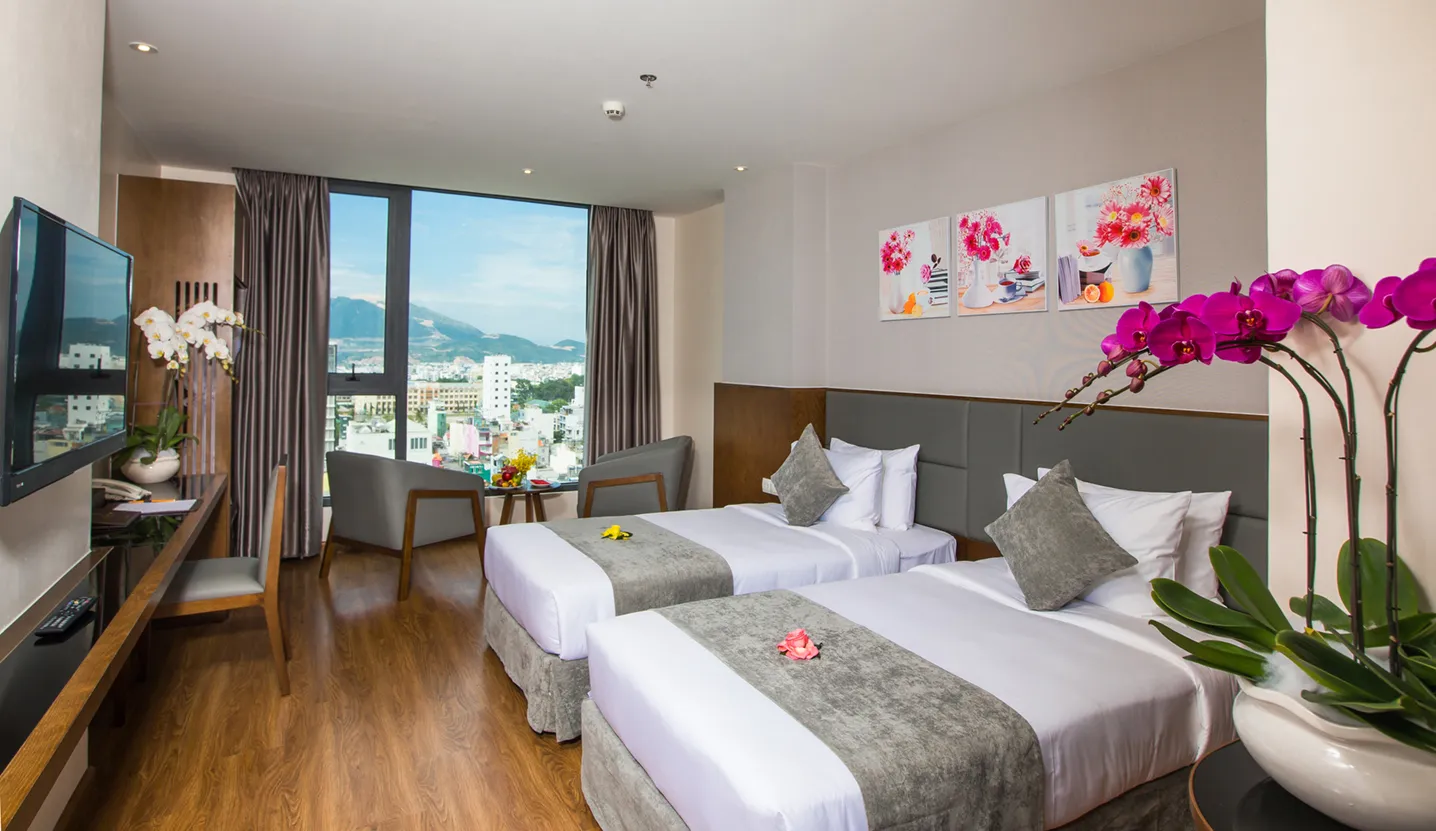 Deluxe City View room at DTX Hotel Nha Trang with modern design and city skyline
