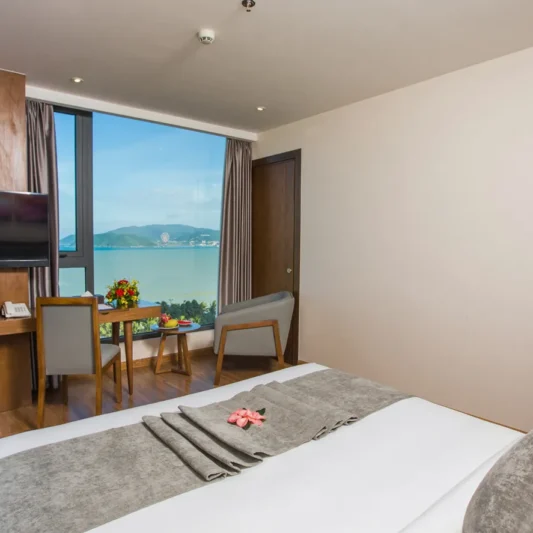 Deluxe Ocean View room at DTX Hotel Nha Trang with modern interior and ocean view