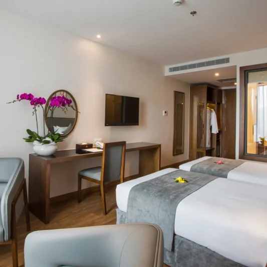 Deluxe City View room at DTX Hotel Nha Trang with modern design and city skyline