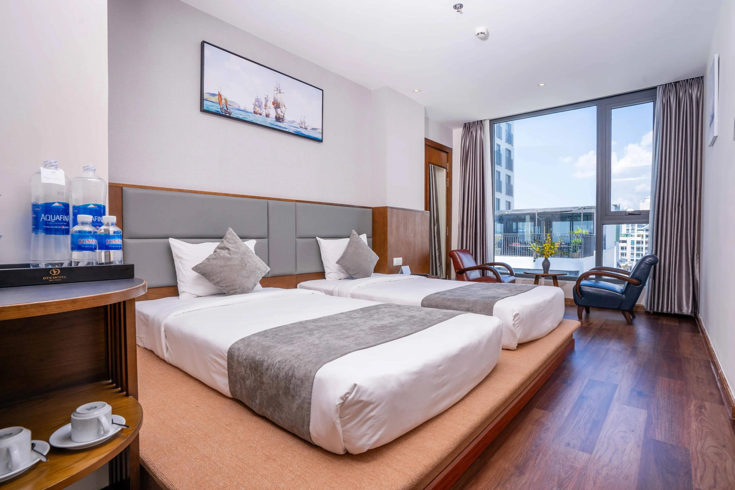 Deluxe City View room at DTX Hotel Nha Trang with modern design and city skyline