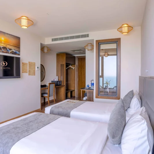 Deluxe Ocean View room at DTX Hotel Nha Trang with modern interior and ocean view