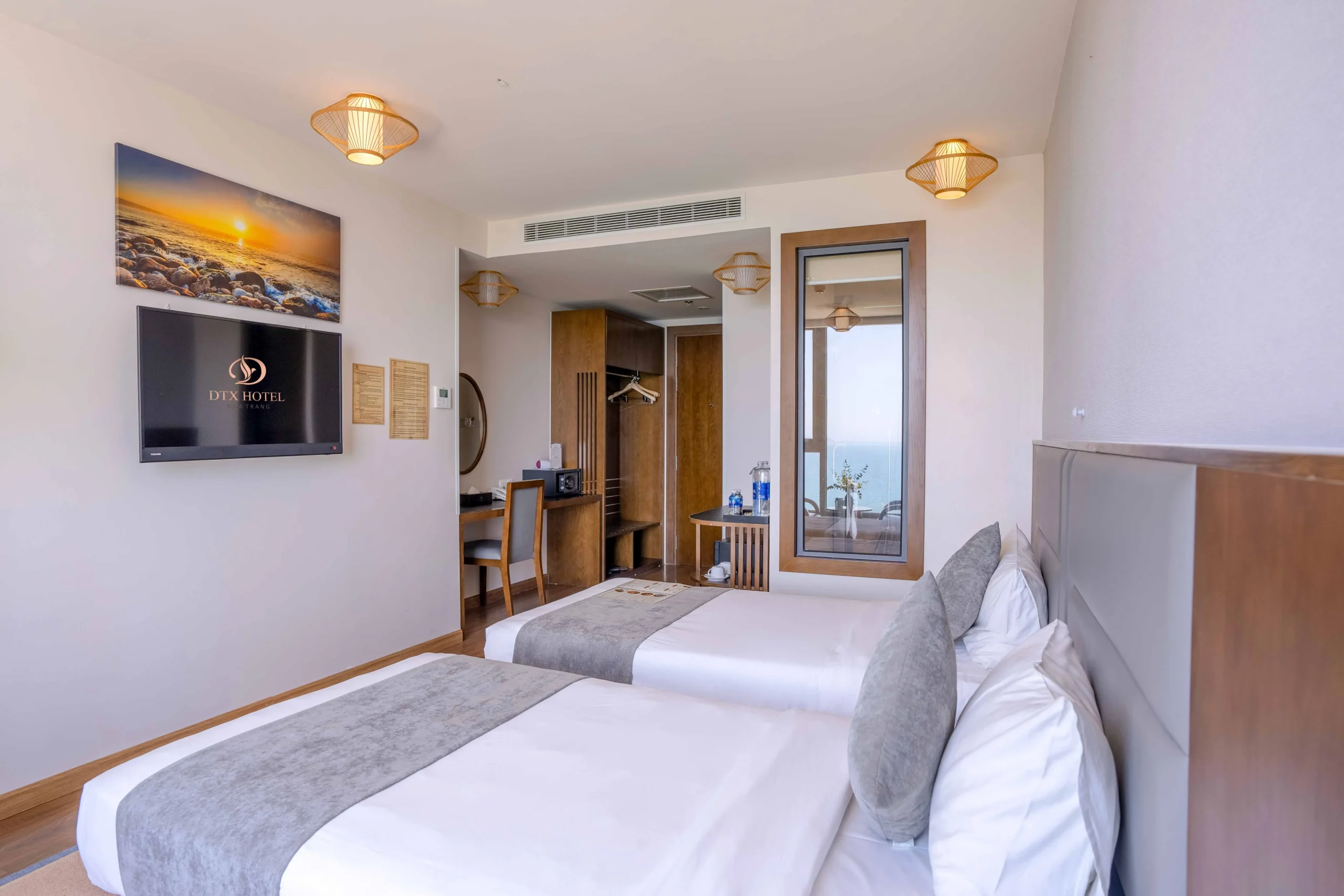 Deluxe Ocean View room at DTX Hotel Nha Trang with modern interior and ocean view