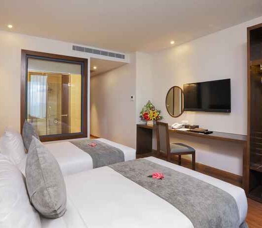 Superior City View room at DTX Hotel Nha Trang with modern design and city skyline view